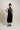 GÉLORIA - Robe satinée avec fleur amovible noir